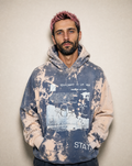 Every Bit of It sweatshirt worn by a model, showing the collage-style graphic print and hand-bleached colorway.