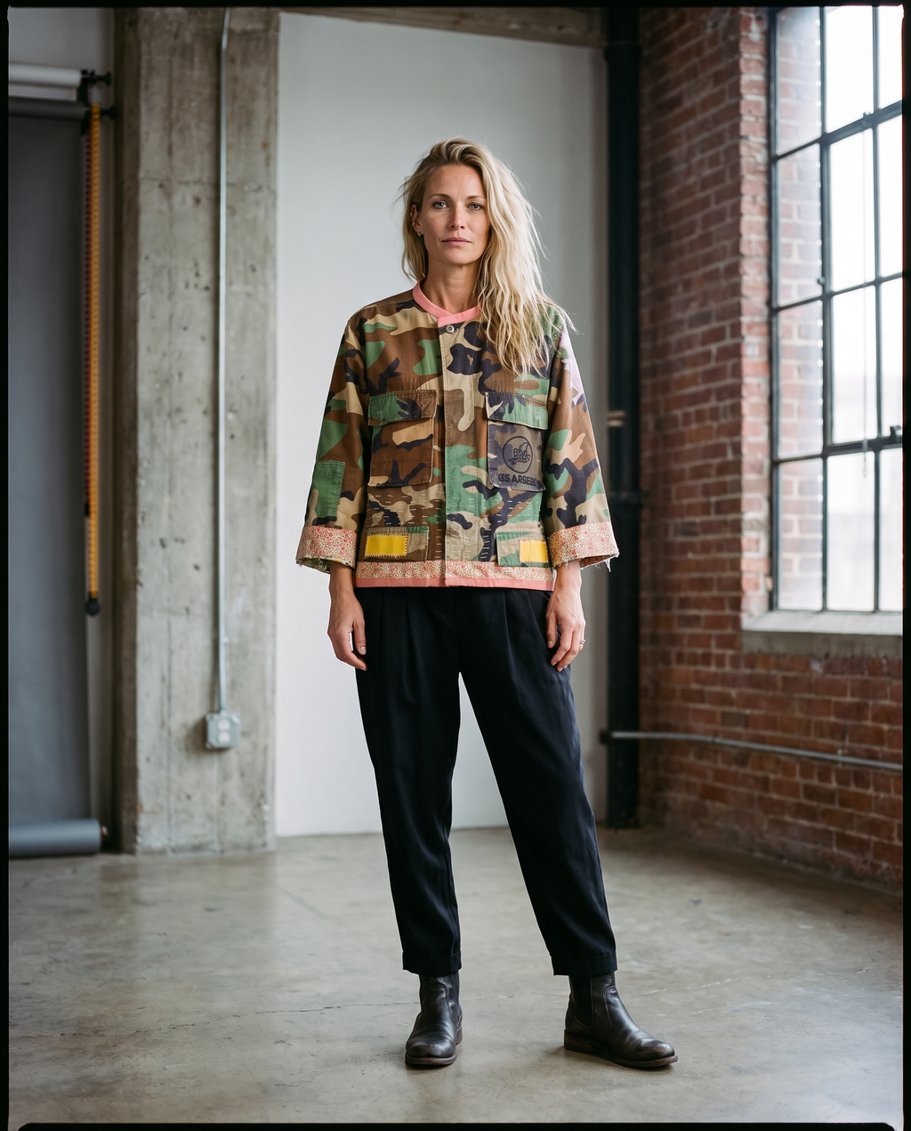 Music Head jacket worn by a model, front view, showing peach collar and hem detail and 3/4 sleeve fit.